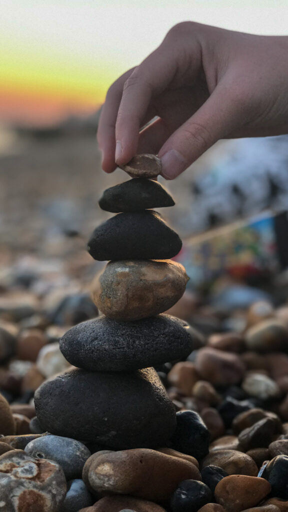 close up person hand holding stones close up person hand holding stones